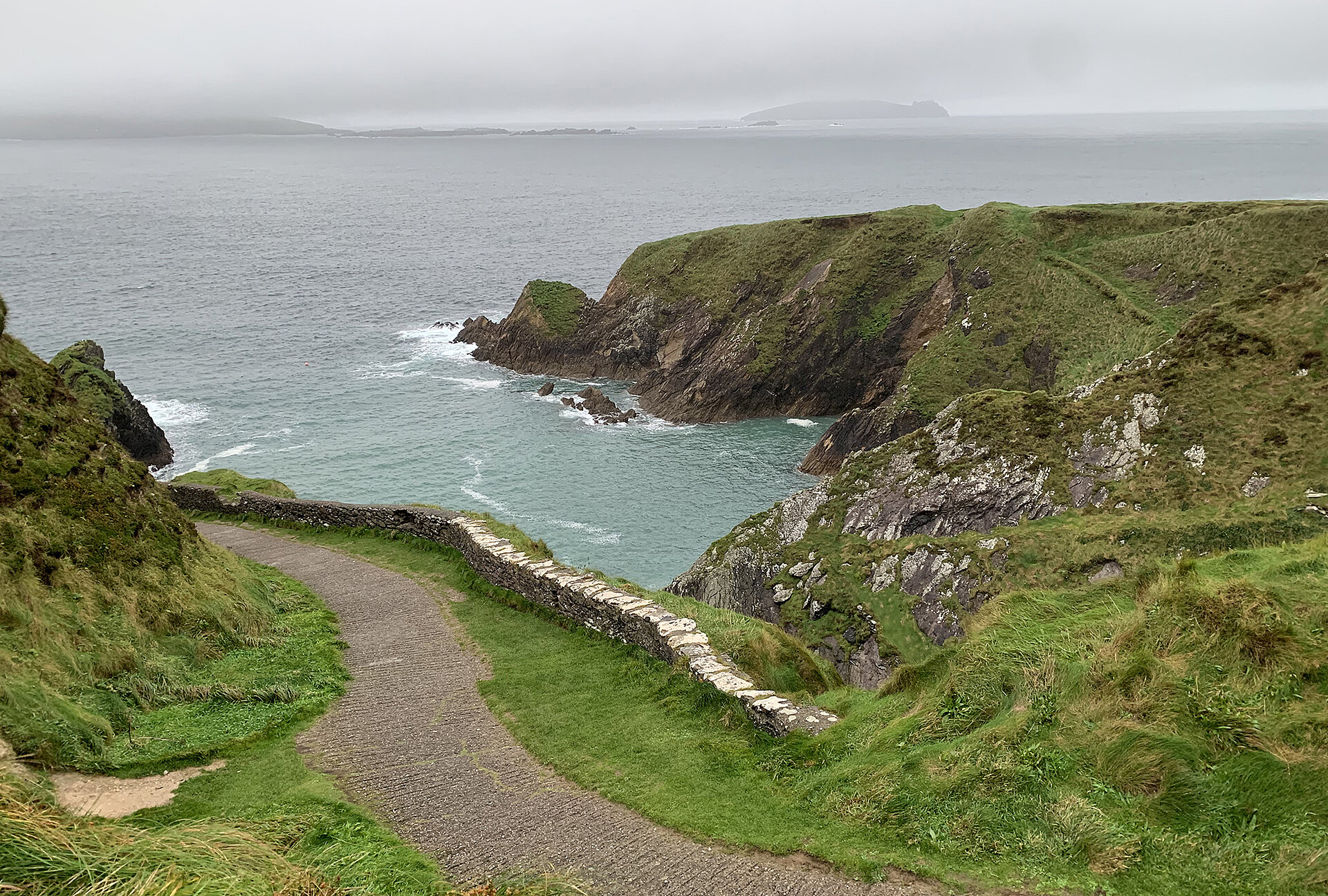 The narrow path to Dunquin Pier is a highlight of the Wild Atlantic Way as well as the Dingle Peninsula. Dunquin Pier on Dingle Peninsula